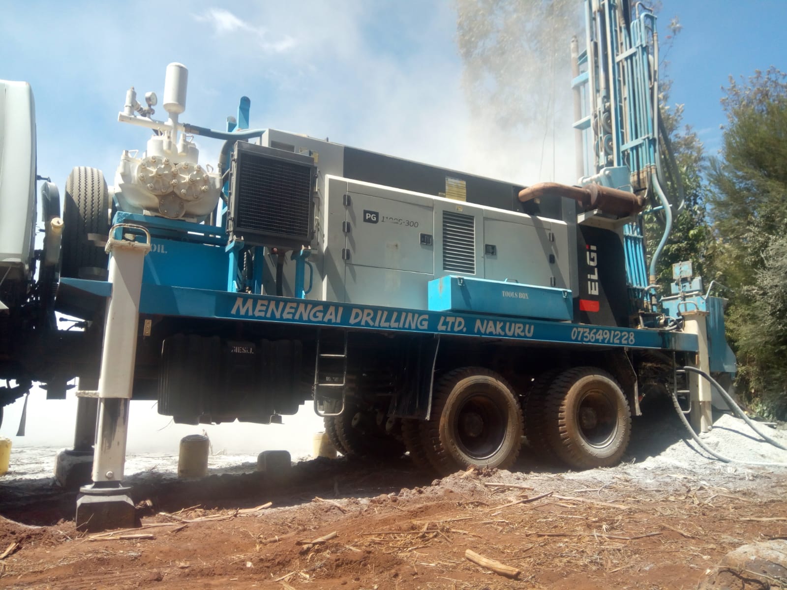 Heavy duty borehole drilling rig penetrating volcanic rock during groundwater drilling in Kenya